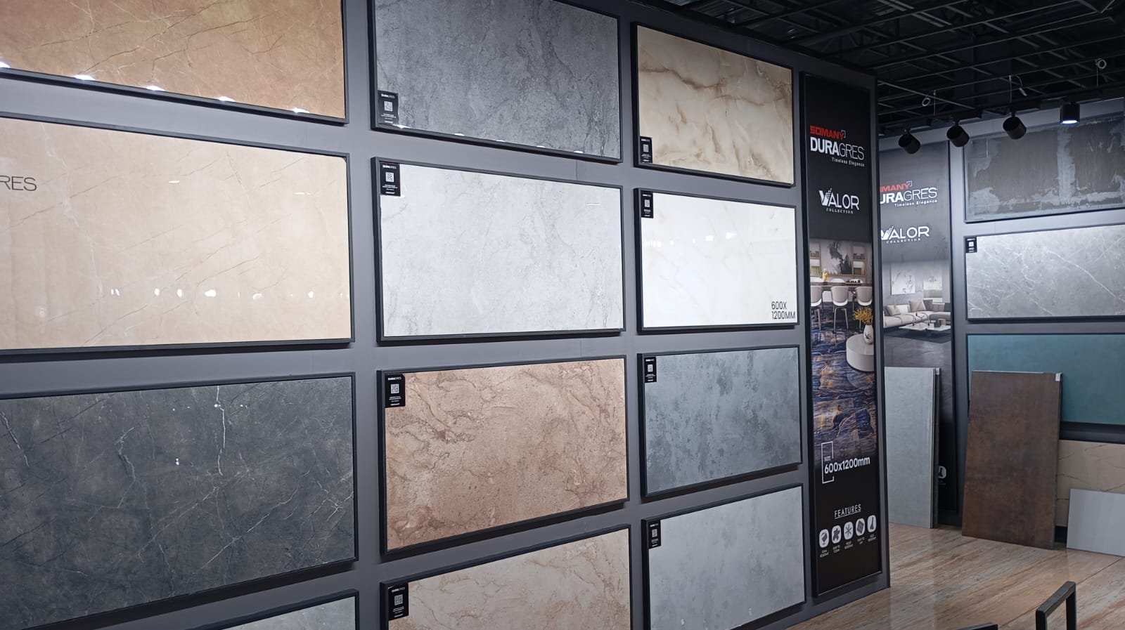 Display wall of large-format marble-look floor and wall tiles at the Devaki Ceramics showroom