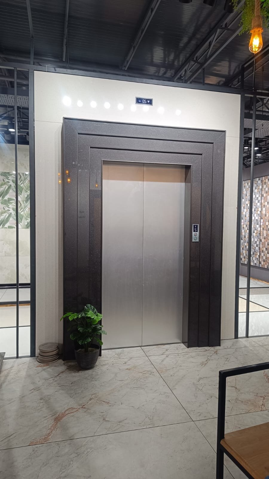 Decorative tile-clad elevator display