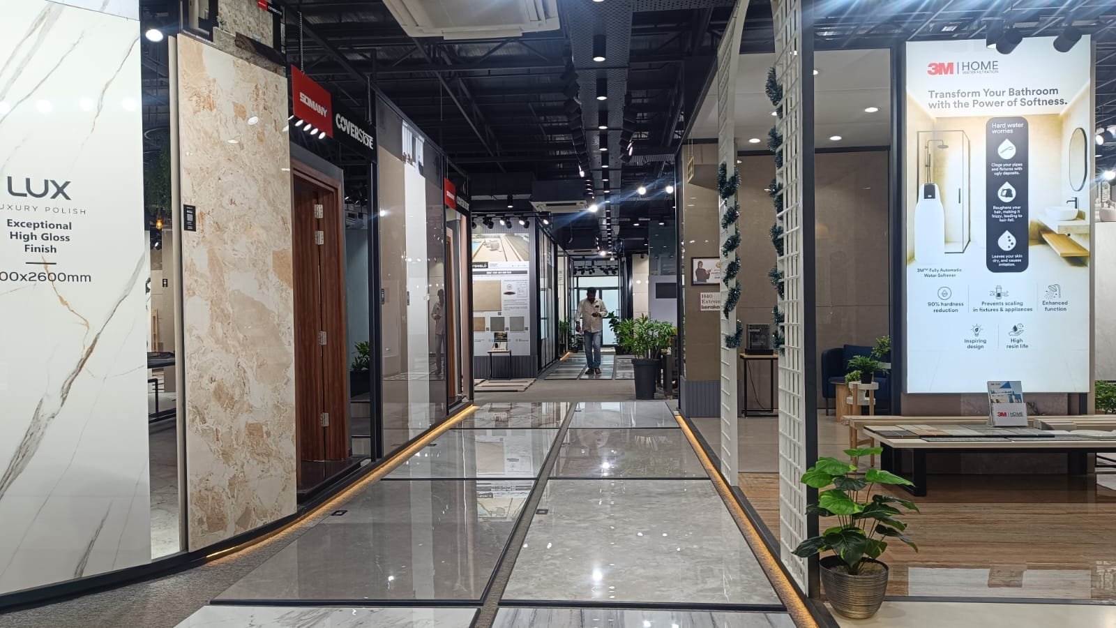 Large-format marble-look tile corridor at Devaki Ceramics showroom, Puducherry
